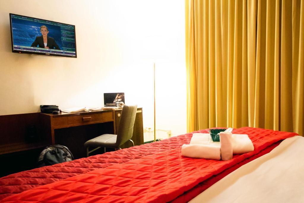 Postel nebo postele na pokoji v ubytování Hotel Palombella & Restaurant