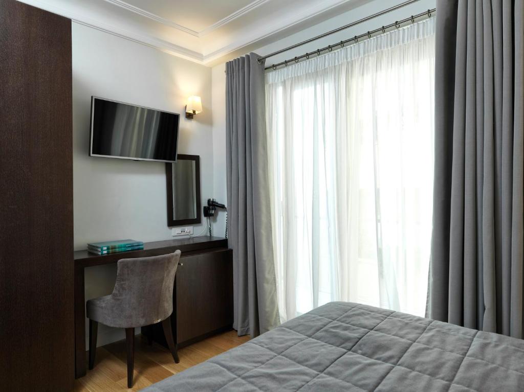 TV a/nebo společenská místnost v ubytování Acropolis Hill Hotel