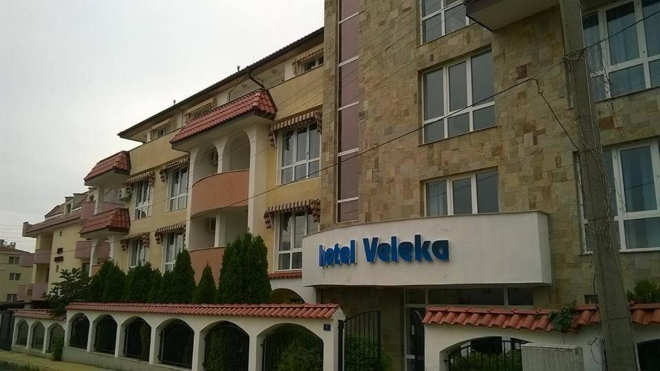 a building with a sign for a hotel vaza at Hotel Veleka in Chernomorets