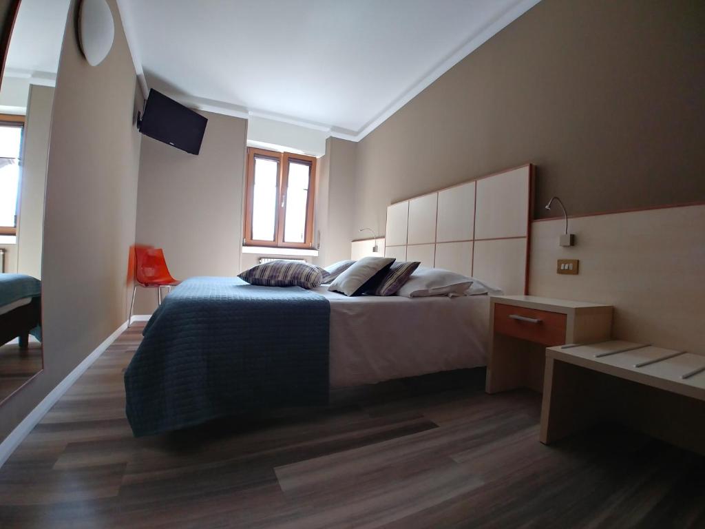 Postel nebo postele na pokoji v ubytování Albergo Aurora