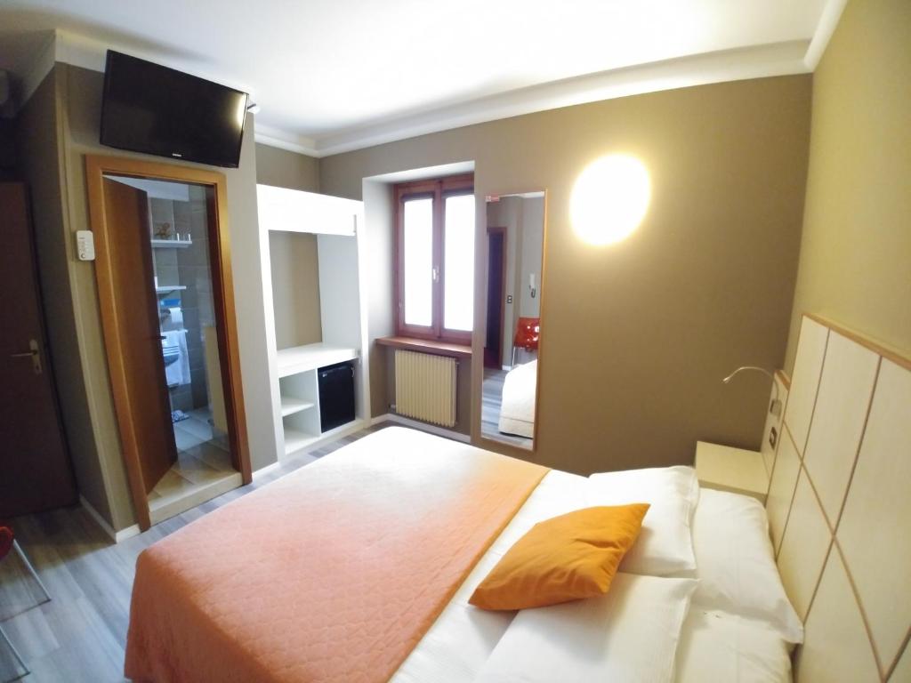 Postel nebo postele na pokoji v ubytování Albergo Aurora