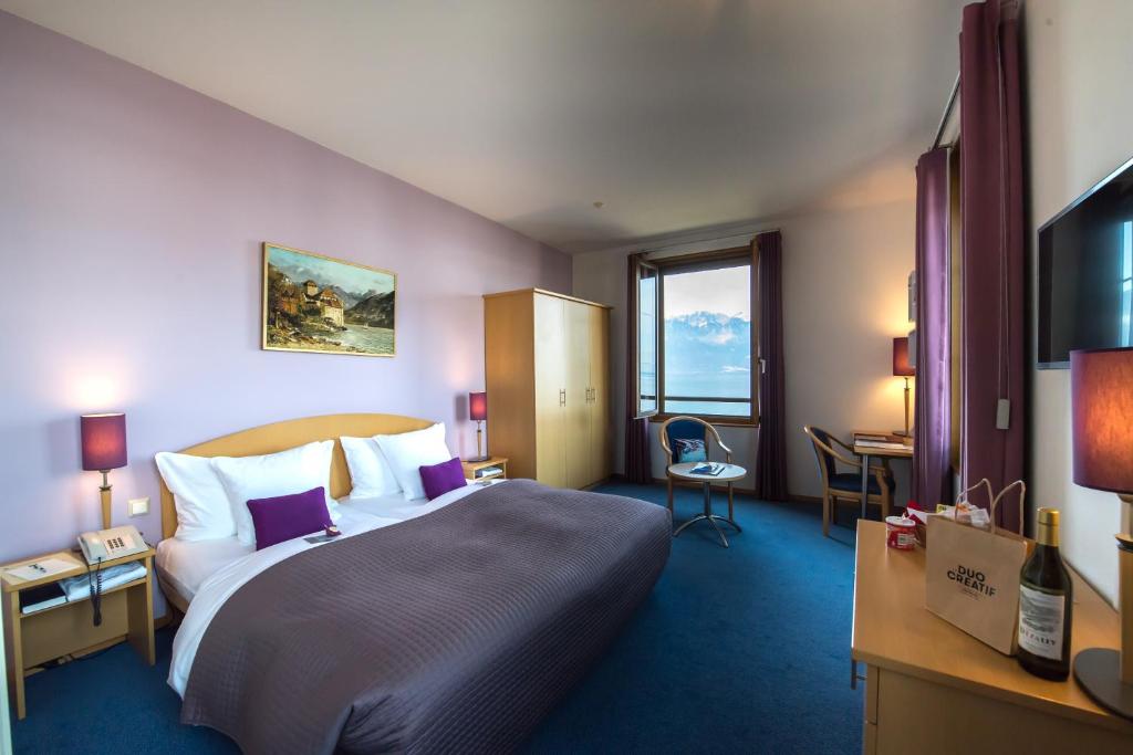 Letto o letti in una camera di Hôtel Bon Rivage