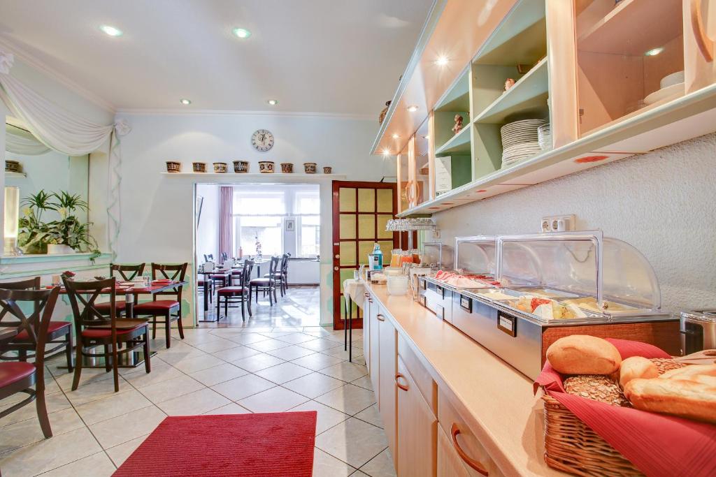 Kuchyň nebo kuchyňský kout v ubytování INA Hotel Consul