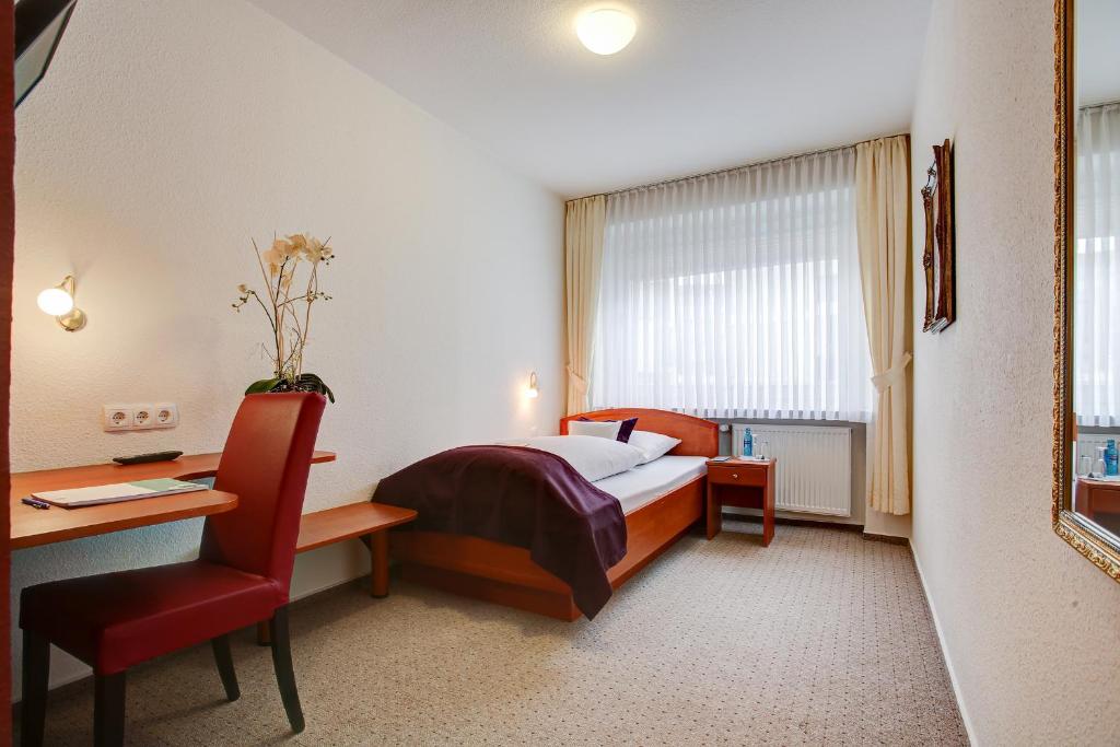 Postel nebo postele na pokoji v ubytování INA Hotel Consul