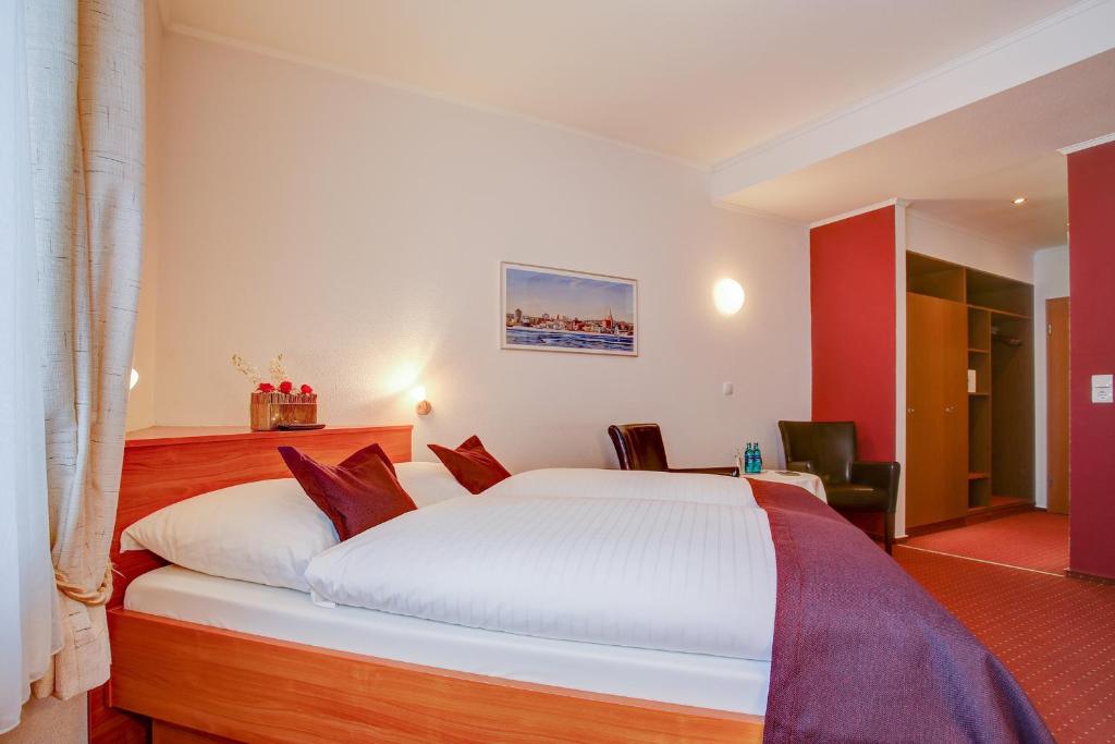 Postel nebo postele na pokoji v ubytování INA Hotel Consul