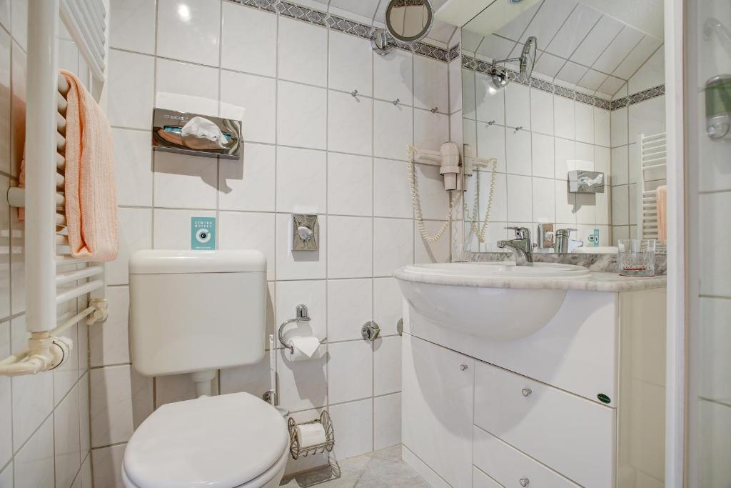 Koupelna v ubytování INA Hotel Consul