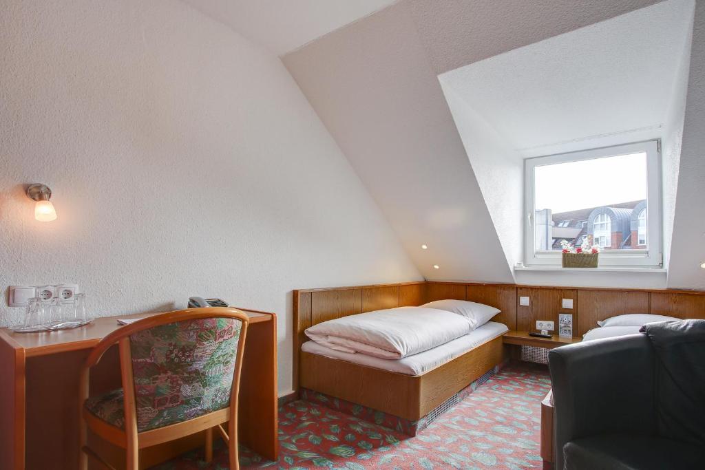 Postel nebo postele na pokoji v ubytování INA Hotel Consul