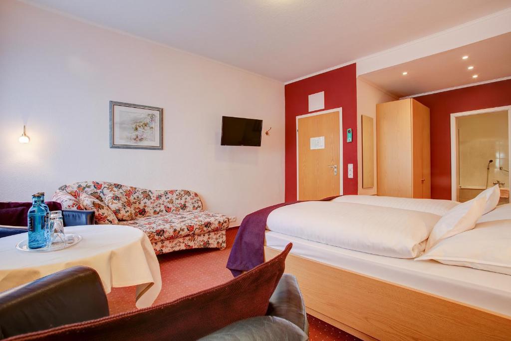 Postel nebo postele na pokoji v ubytování INA Hotel Consul