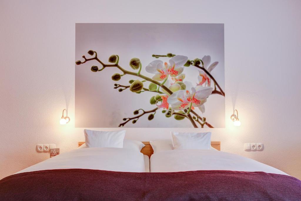 Postel nebo postele na pokoji v ubytování INA Hotel Consul