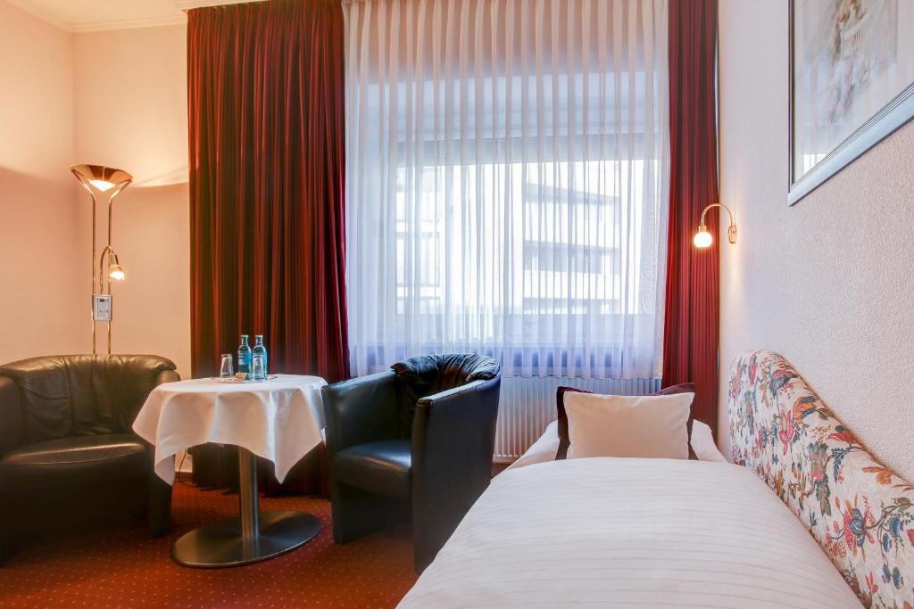 Postel nebo postele na pokoji v ubytování INA Hotel Consul