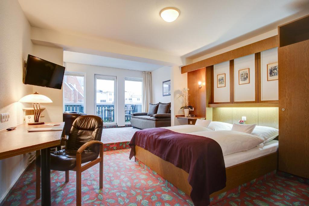 Postel nebo postele na pokoji v ubytování INA Hotel Consul