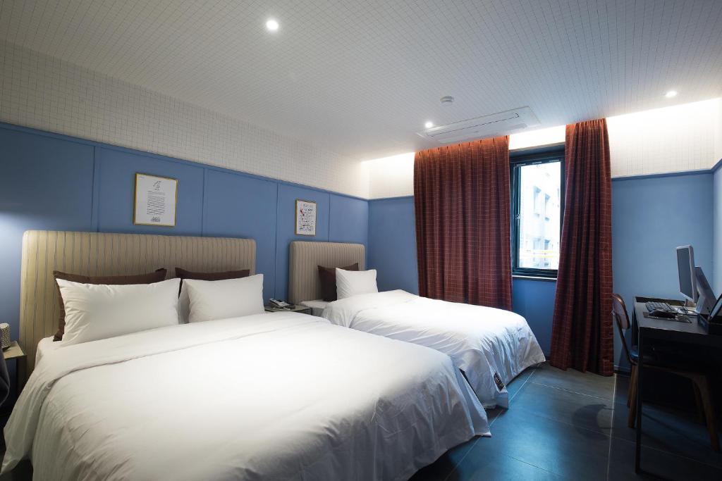 Postel nebo postele na pokoji v ubytování Brown-Dot Hotel Choeup