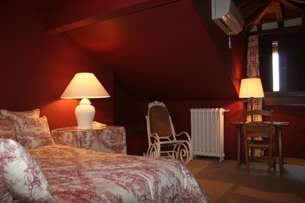 מיטה או מיטות בחדר ב-La Posada de Don Mariano