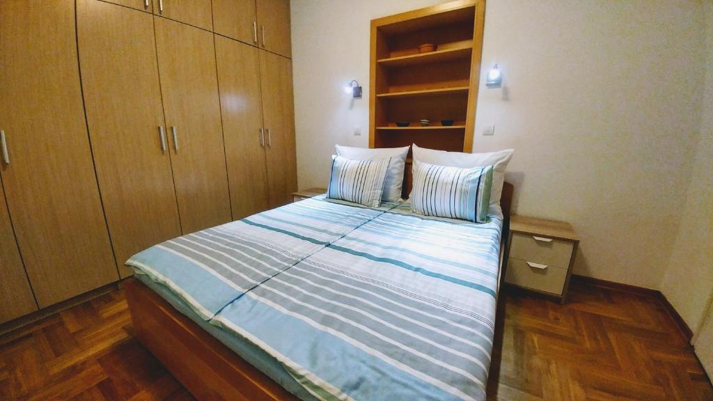 Postel nebo postele na pokoji v ubytování Apartment Harmonija