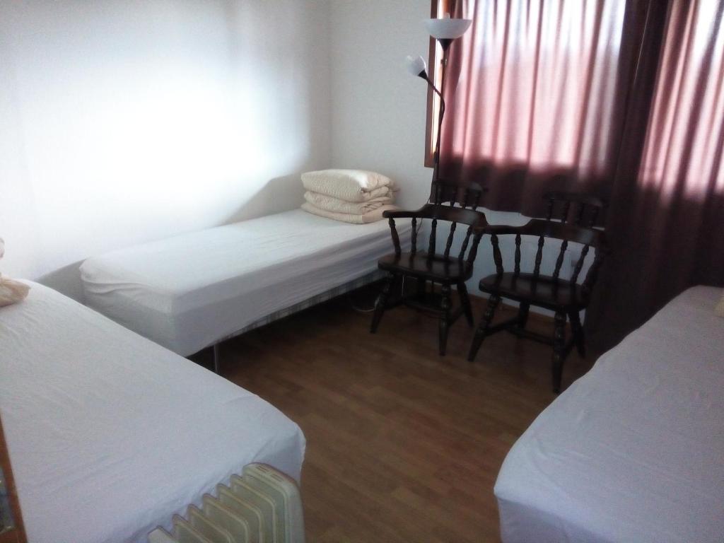 Postel nebo postele na pokoji v ubytování Gardenview Room