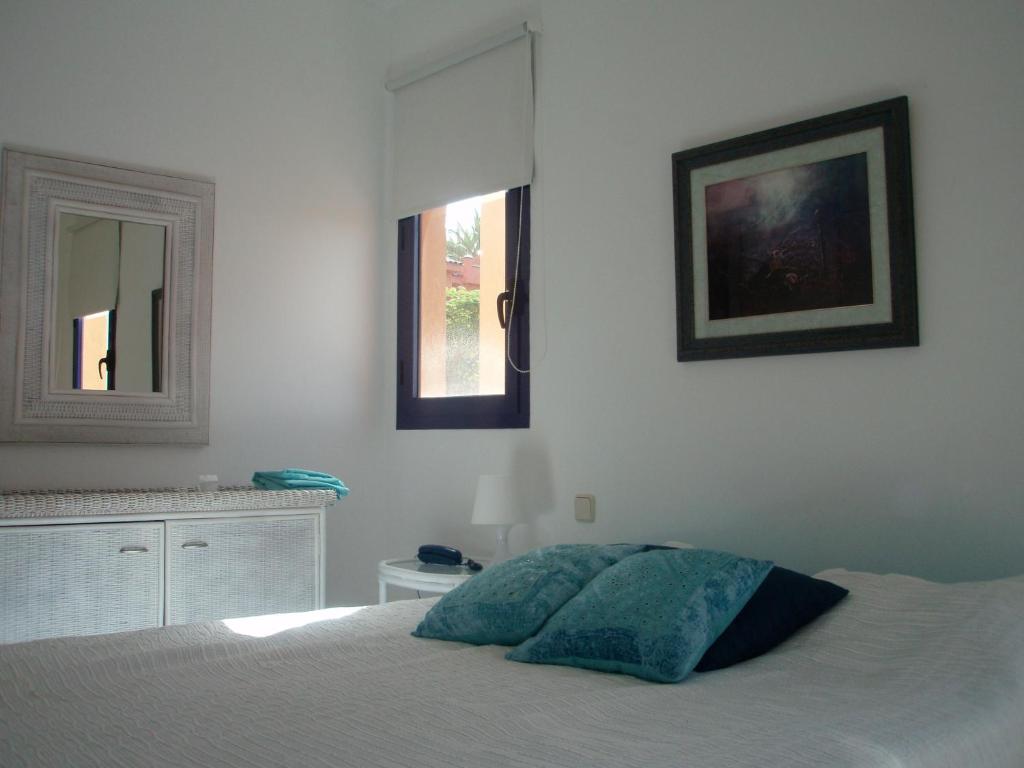 A bed or beds in a room at Bahia Meloneras Villa