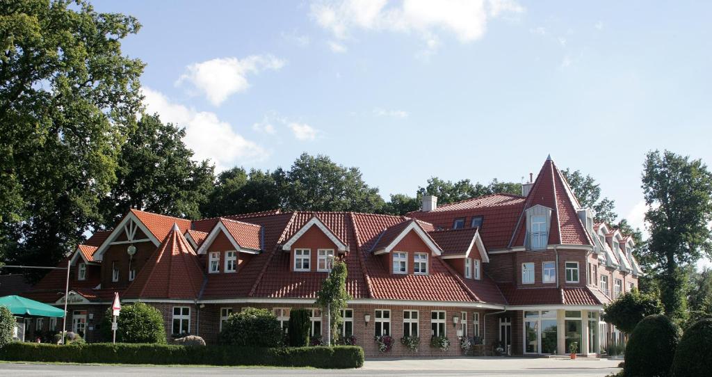 a large house with red roof at Gasthof Robben in Twist