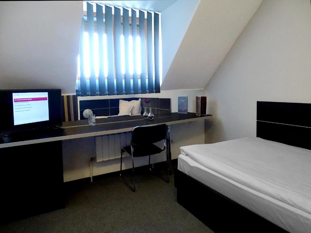 Postel nebo postele na pokoji v ubytování Prince Hotel