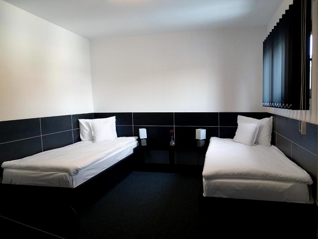 Postel nebo postele na pokoji v ubytování Prince Hotel