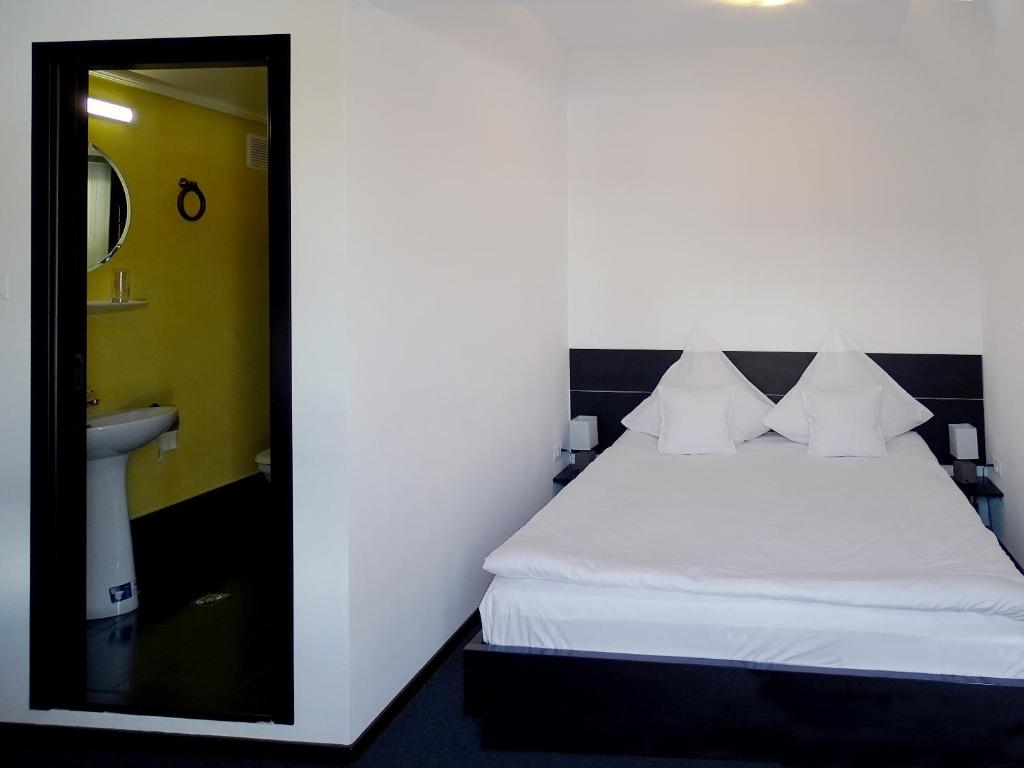 Postel nebo postele na pokoji v ubytování Prince Hotel