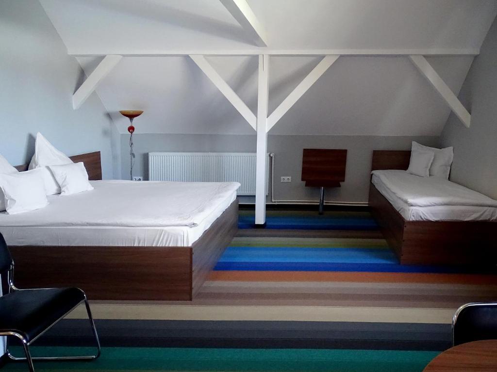 Postel nebo postele na pokoji v ubytování Prince Hotel