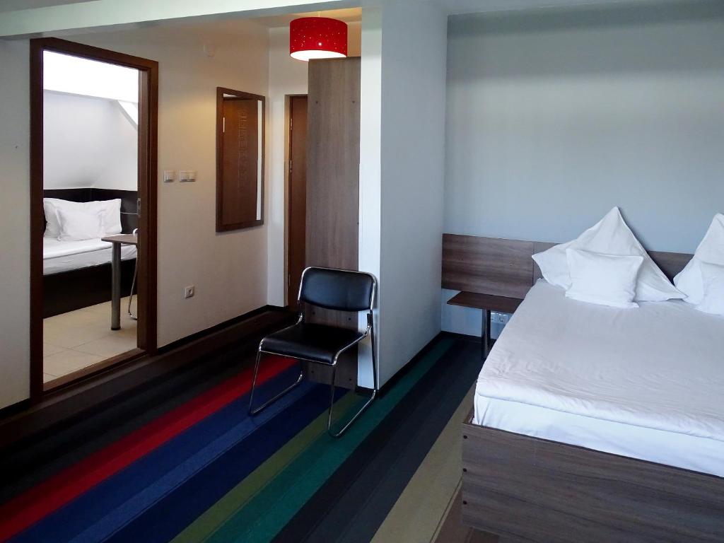 Postel nebo postele na pokoji v ubytování Prince Hotel