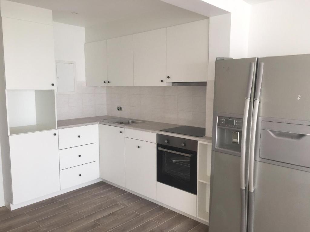 
A kitchen or kitchenette at Apartment Havenzicht

