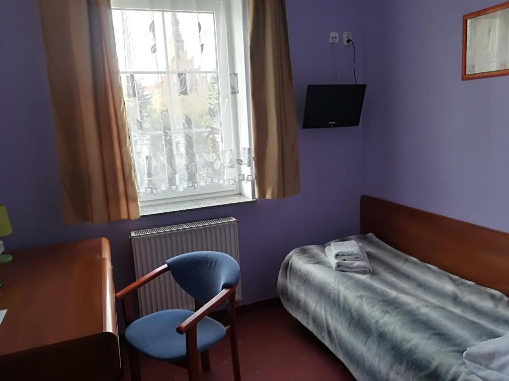 Posteľ alebo postele v izbe v ubytovaní Hotel E-lektor