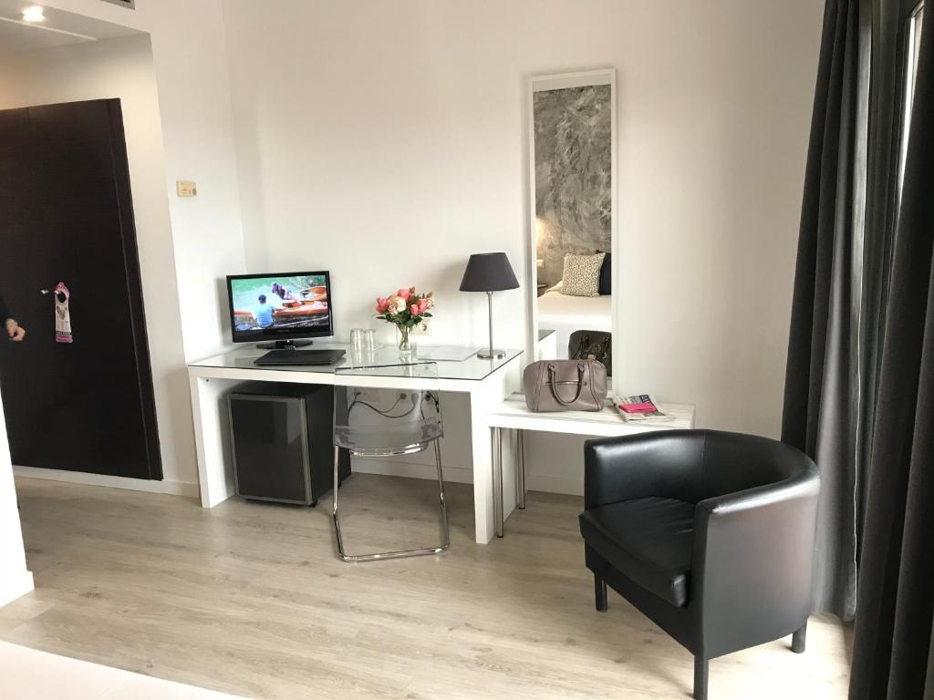 TV a/nebo společenská místnost v ubytování Hotel Restaurant Bon Retorn
