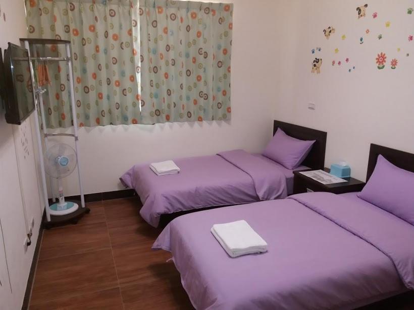 Postel nebo postele na pokoji v ubytování Jin Xi Fu B&B