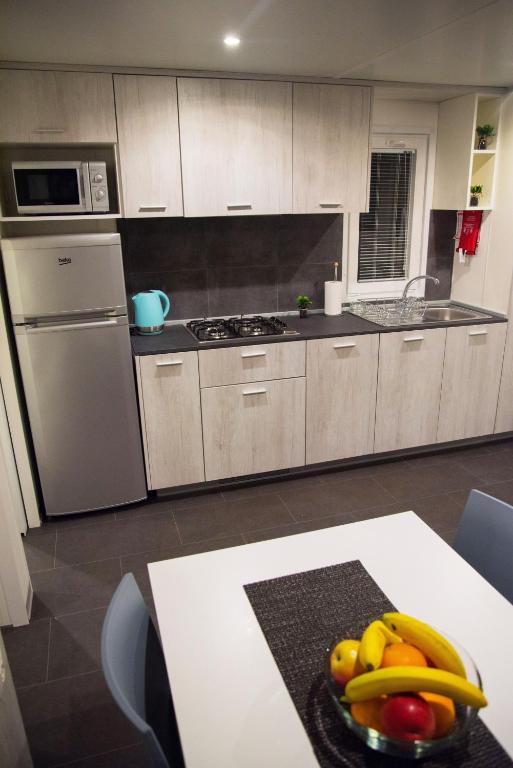 Kuchyň nebo kuchyňský kout v ubytování Mobile Home Amélie