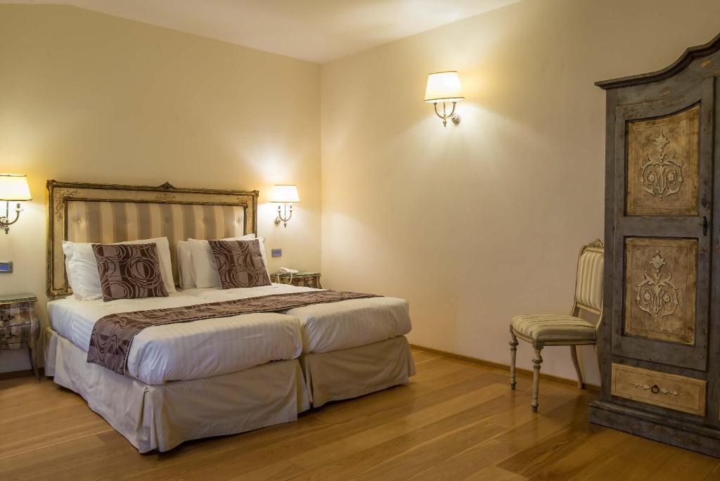 Postel nebo postele na pokoji v ubytování Hotel Atlantic Palace