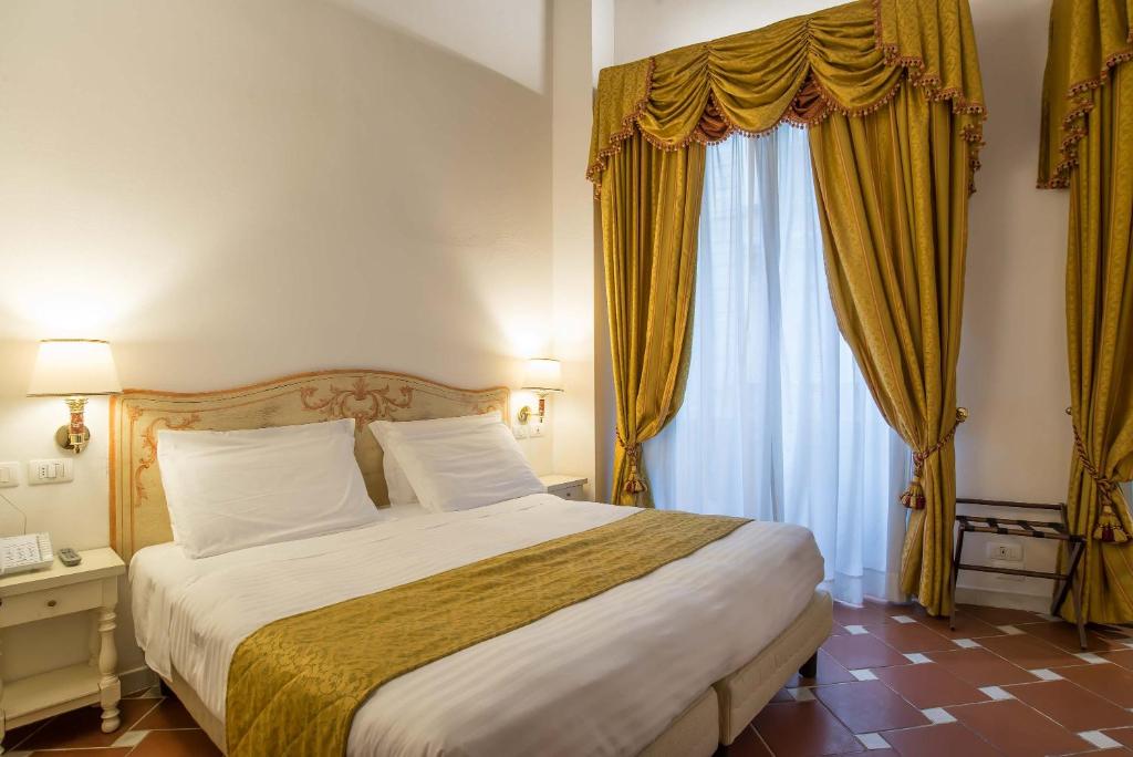 Postel nebo postele na pokoji v ubytování Hotel Atlantic Palace