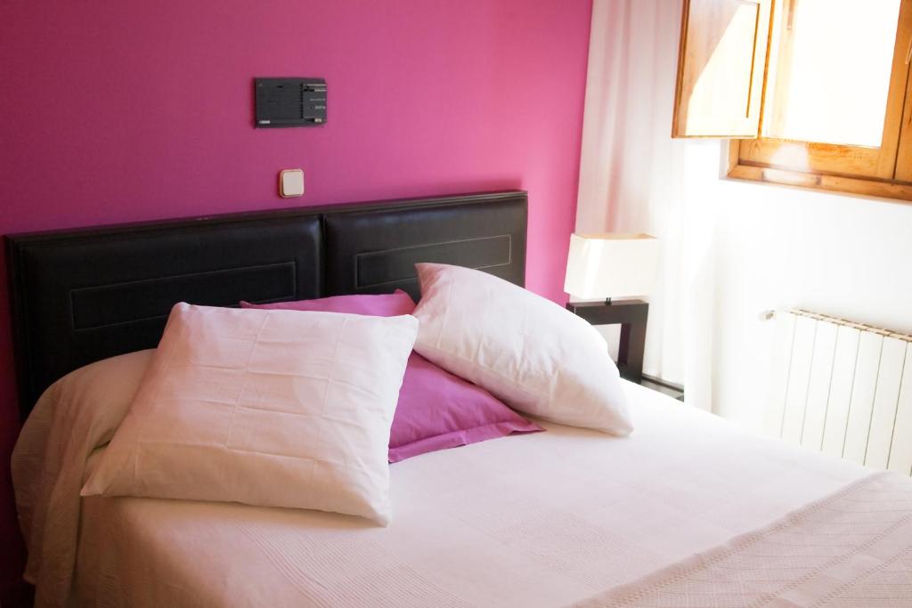 Postel nebo postele na pokoji v ubytování Gran Hostal San Segundo