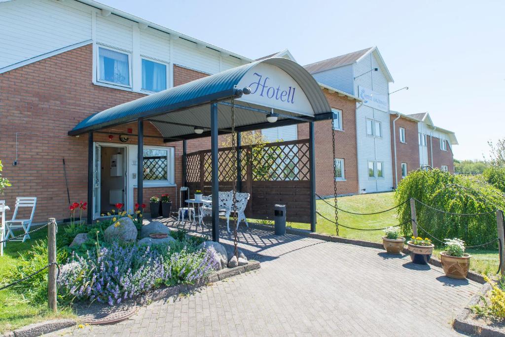 a building with awning in front of a building at Hotell Angöringen in Karlskrona