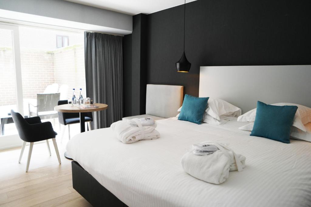 Postel nebo postele na pokoji v ubytování C-Hotels Andromeda