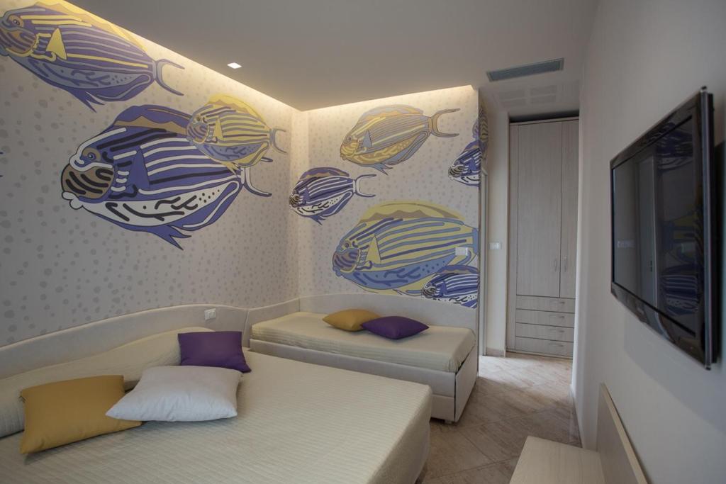 Postel nebo postele na pokoji v ubytování Hotel Principe