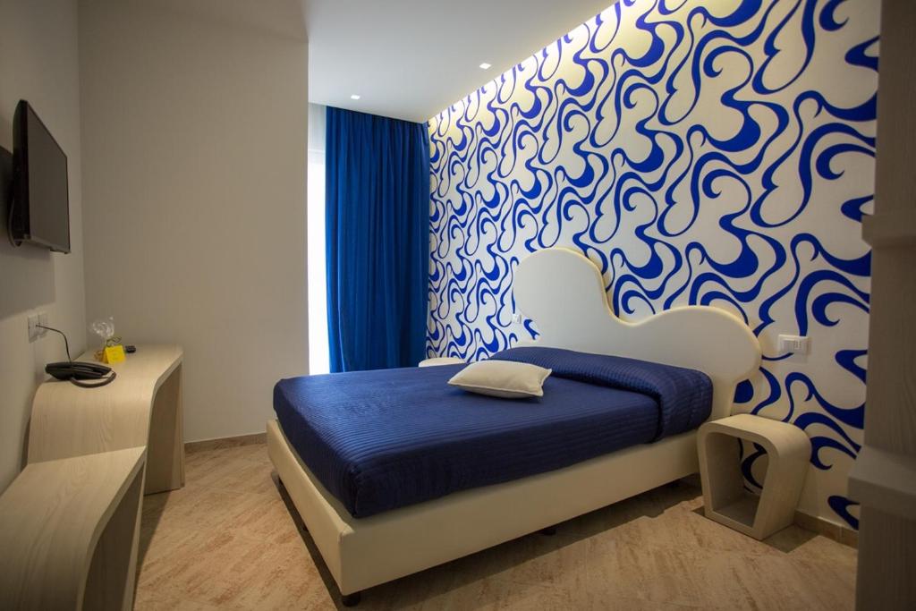 Postel nebo postele na pokoji v ubytování Hotel Principe