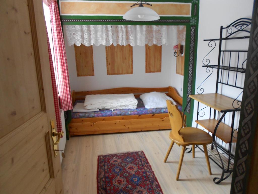 Postel nebo postele na pokoji v ubytování La vecchia Mesnerhaus