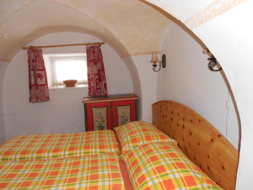 Postel nebo postele na pokoji v ubytování La vecchia Mesnerhaus