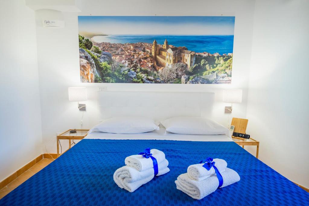 Posteľ alebo postele v izbe v ubytovaní Cefalu in Blu