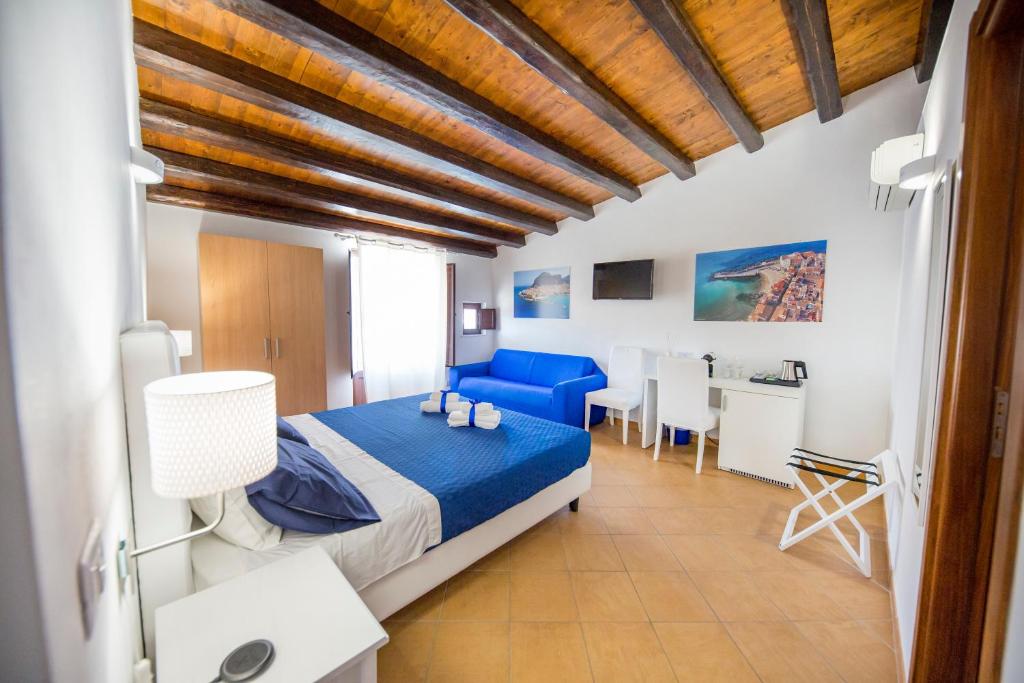 Posteľ alebo postele v izbe v ubytovaní Cefalu in Blu