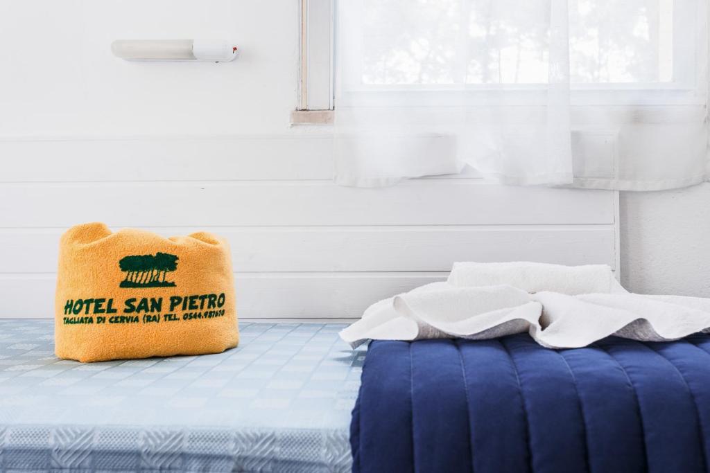 Postel nebo postele na pokoji v ubytování Hotel San Pietro