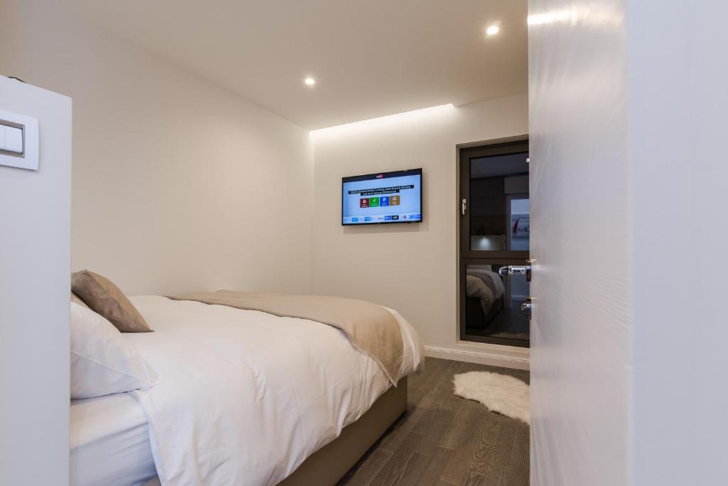 Łóżko lub łóżka w pokoju w obiekcie Luxury Apartment Kortina