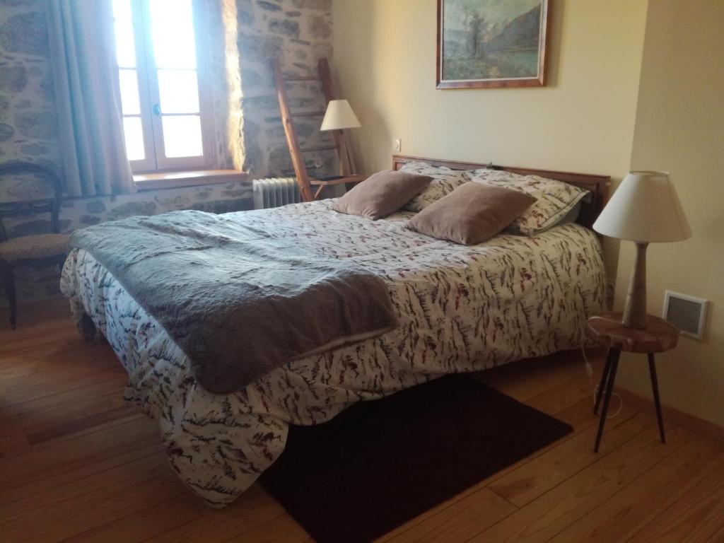 Postel nebo postele na pokoji v ubytování chambres et table d'hôtes du Péré