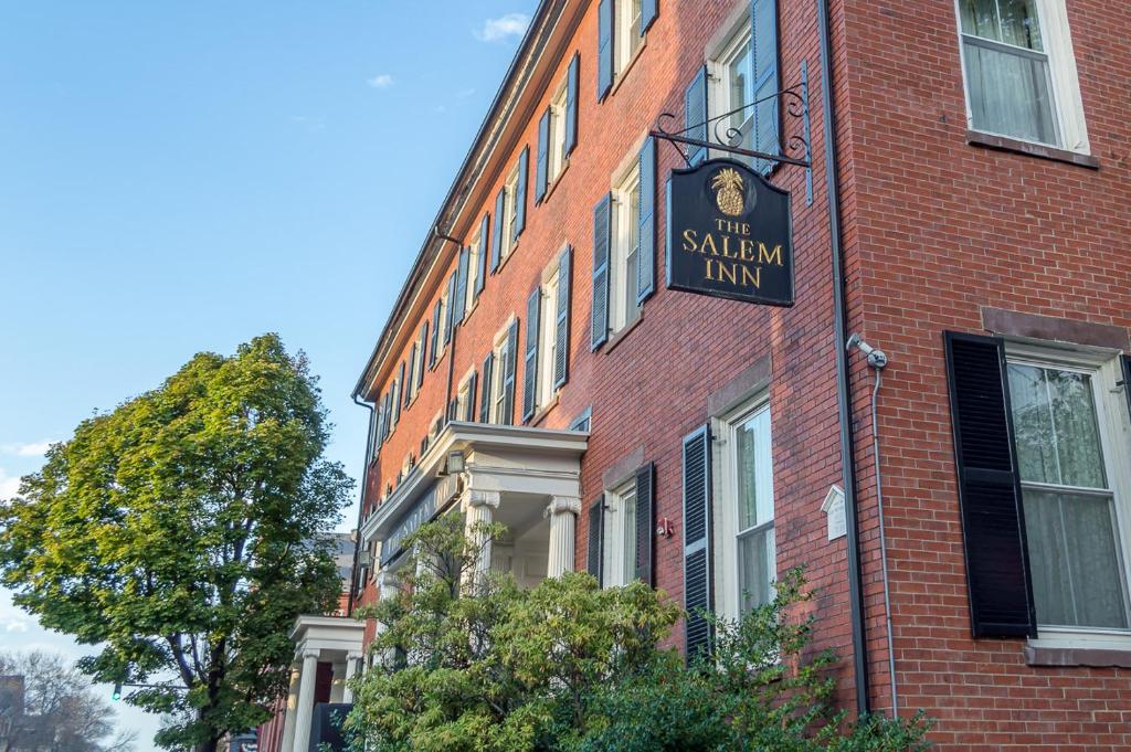 a brick building with a sign for the salem inn at The Salem Inn in Salem