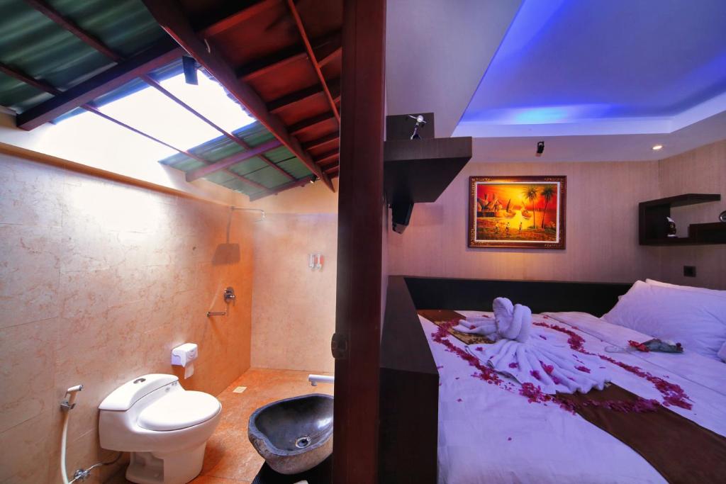 Postel nebo postele na pokoji v ubytování Sari Gili Bungalow