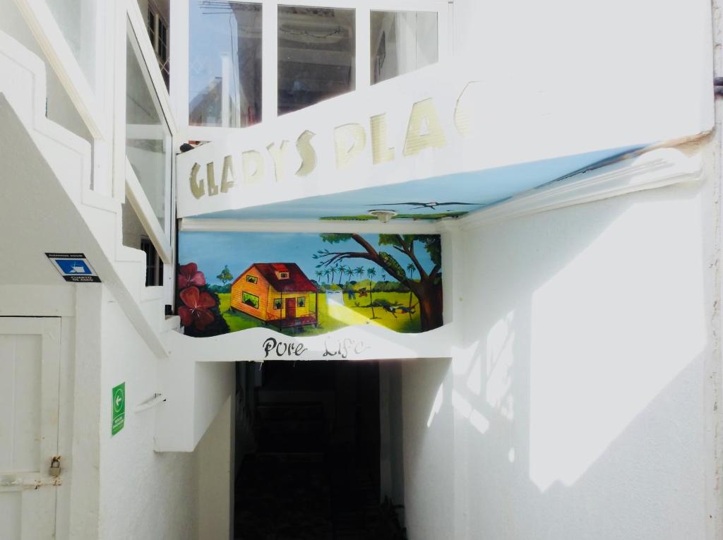 a hallway with a sign that reads city hall at Posada Gladys Place in San Andrés
