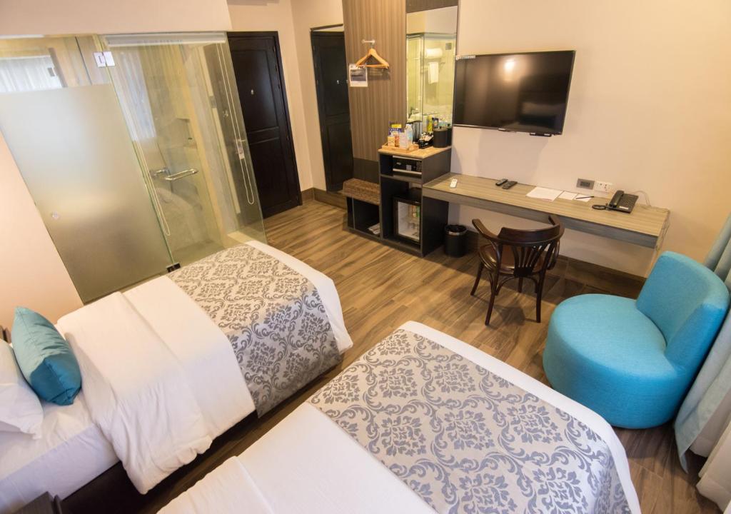 TV a/nebo společenská místnost v ubytování Goldberry Lite Hotel