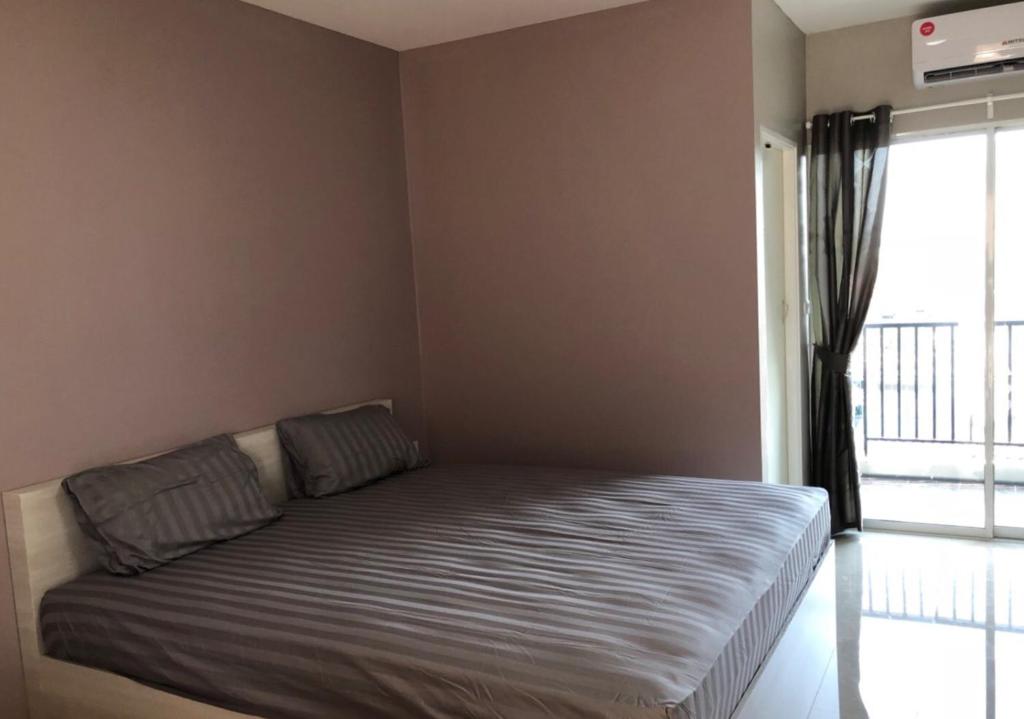 Postel nebo postele na pokoji v ubytování H12, The Stylish Apartment